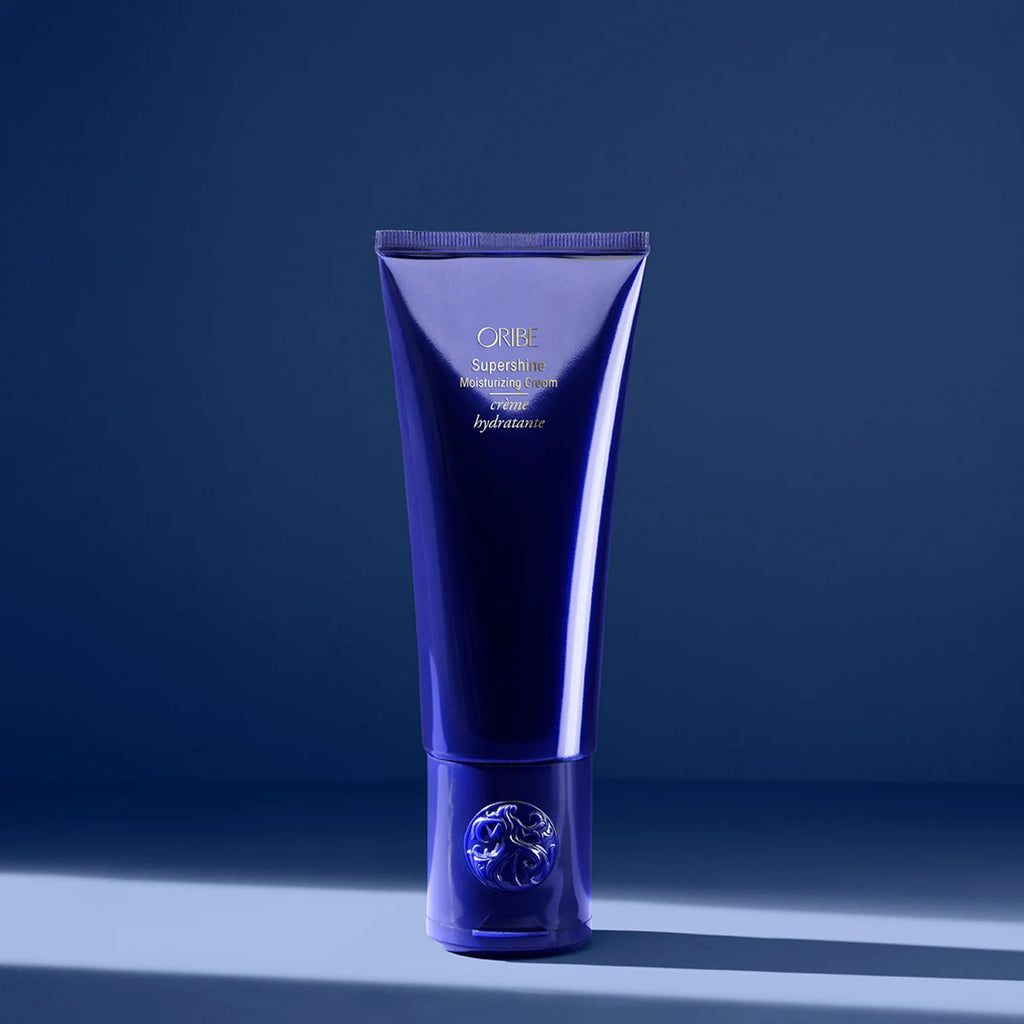 Blue haircare tube on a dark blue background