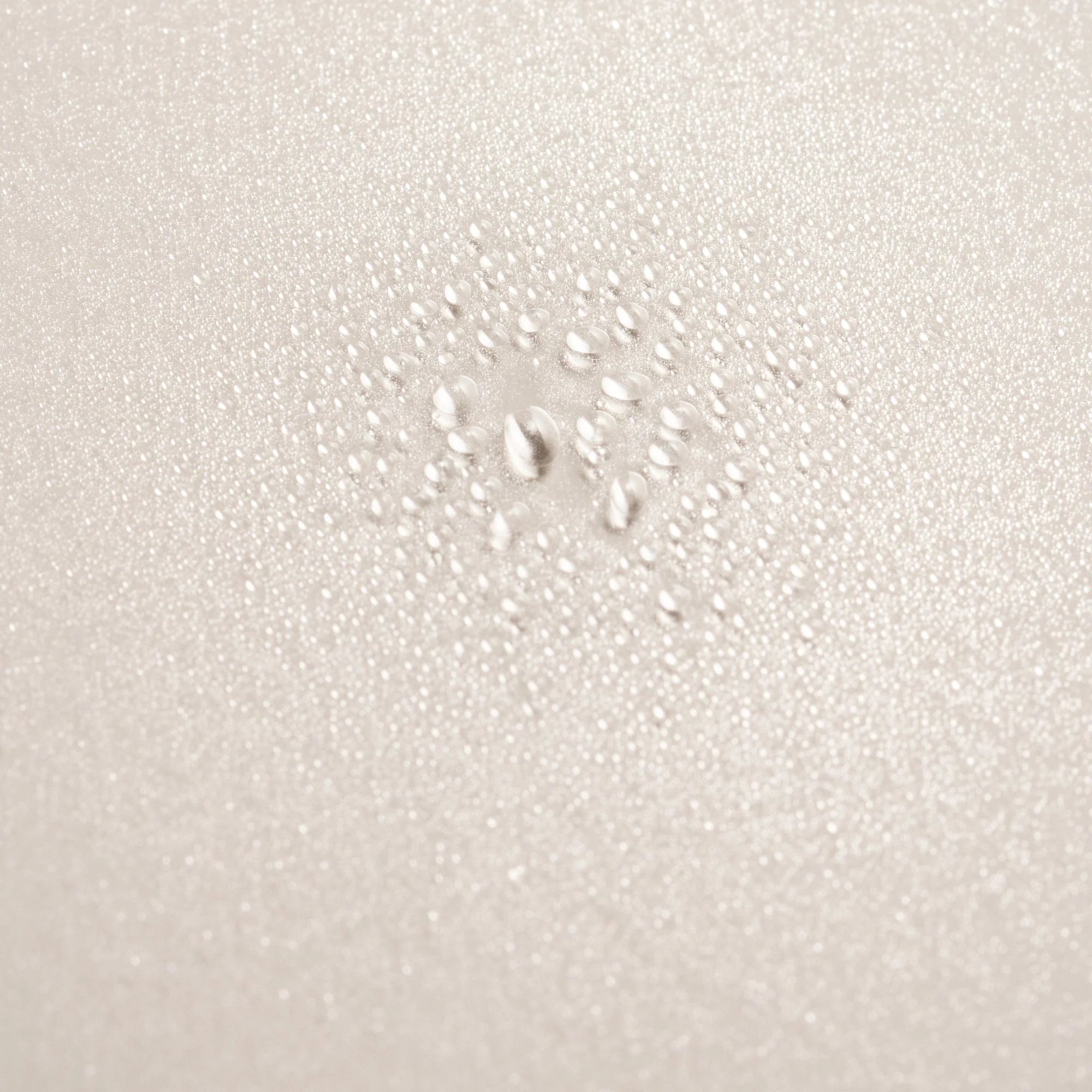 Close-up of a textured white surface with small bubbles