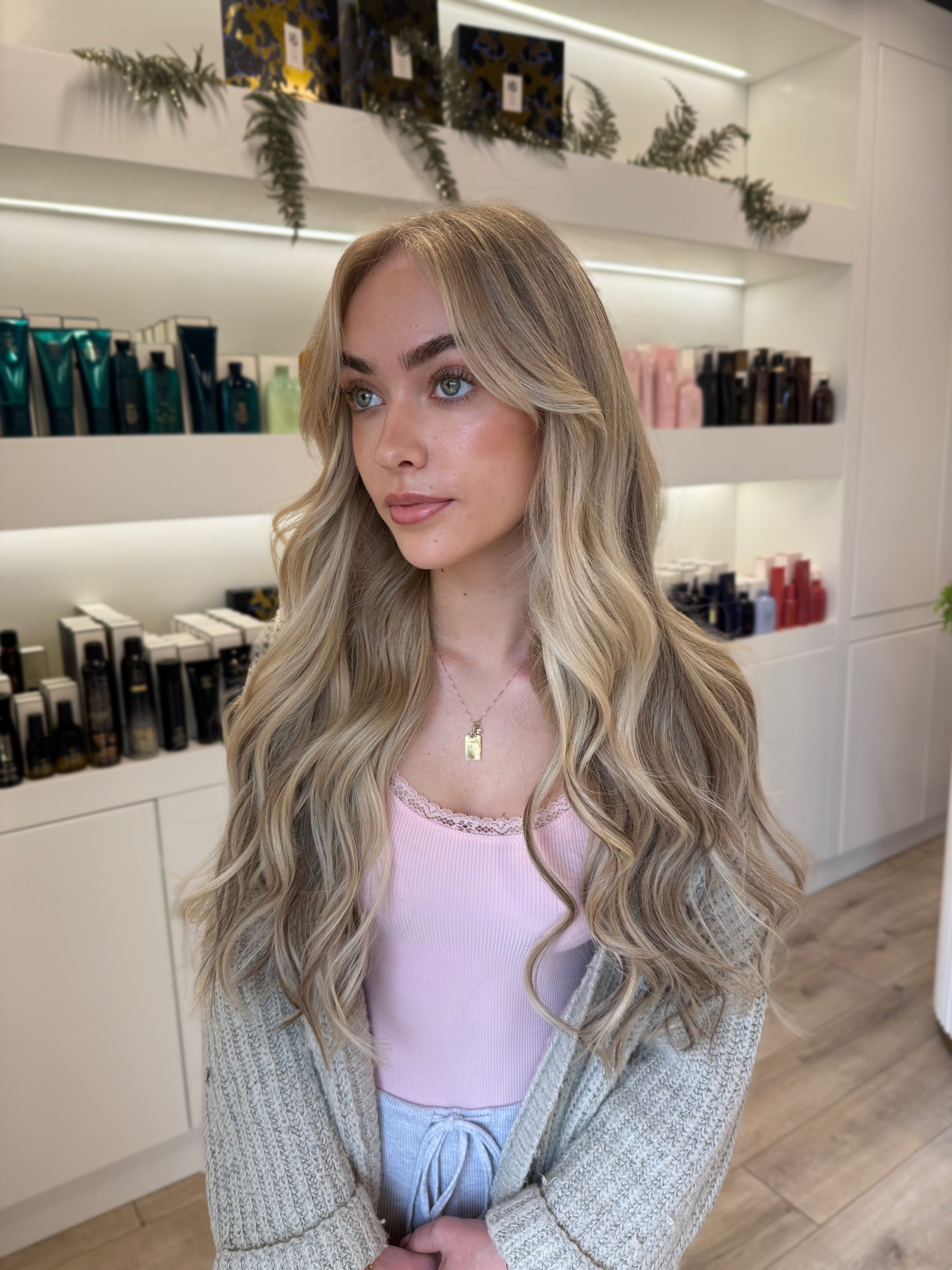 Woman with long blonde hair in a beauty salon setting